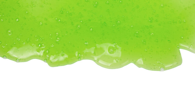 Green slime toy in woman hand isolated on white.