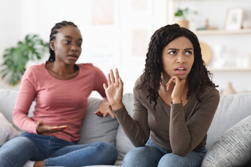 Two african american women fighting at home