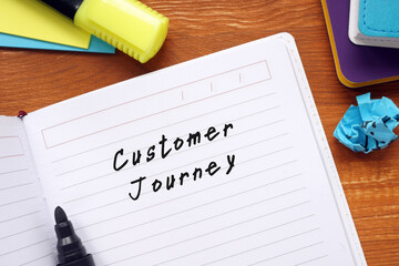 Financial concept meaning Customer Journey with inscription on the sheet.