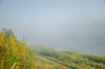 Thick fog on the river Bank