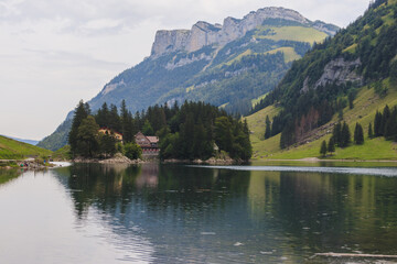 Fototapeta premium Seealpsee Switzerland Appenzeller Alps, houses, alm, hoher kasten, säntis, lake