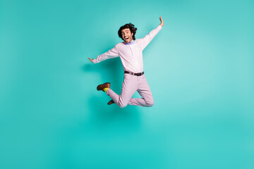 Fototapeta na wymiar Full body photo of happy crazy gentleman jump dressed formal outfit yellow socks isolated on turquoise color background