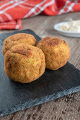 Homemade croquettes stuffed with broccoli and Parmesan cheese