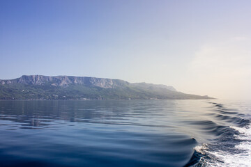 Republic of Crimea, Balaklava city Sea in the morning and mountains illuminated by the sun. Black Sea.