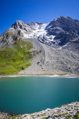 Naklejka na ściany i meble Long lake and Grande Casse Alpine glacier in French alps