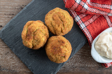 Homemade croquettes stuffed with broccoli and Parmesan cheese