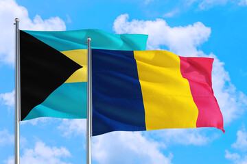 Chad and Bahamas national flag waving in the windy deep blue sky. Diplomacy and international relations concept.