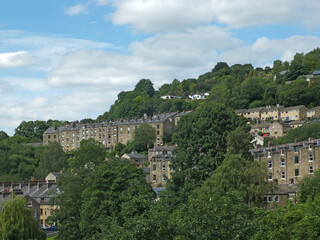 Fototapeta na wymiar view of the streets and houses in hebden bridge in west yorkshire in summer surrounded by trees