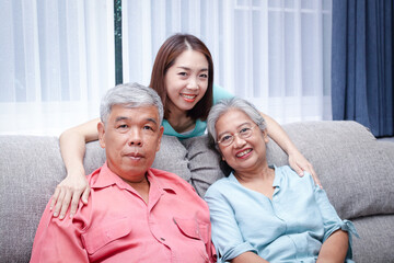 Fototapeta na wymiar Asian family The daughter takes care of the elderly parents to be happy. Concept of health care Living in retirement