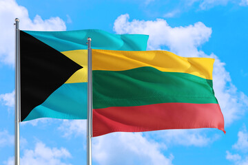 Lithuania and Bahamas national flag waving in the windy deep blue sky. Diplomacy and international relations concept.