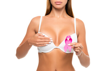 Cropped view of woman in bra showing symbol of breast cancer awareness isolated on white