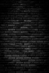 Naklejka na ściany i meble Black brick walls that are not plastered background and texture. The texture of the brick is black. Background of empty brick basement wall.