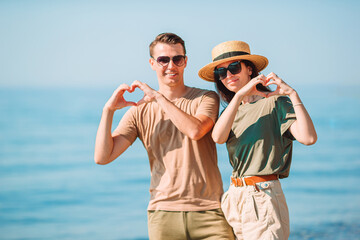 Young couple on white beach during summer vacation.