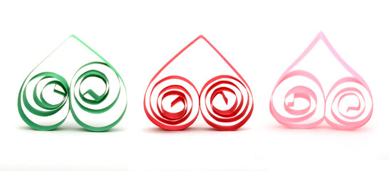 A three quilling origami hearts on white
