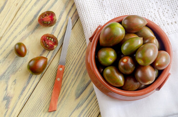 Varietal tomatoes on a wooden background