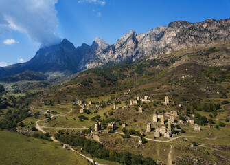 Aerial view of medieval ancient stone battle tower complex in the mountains of Ingushetia, Russia