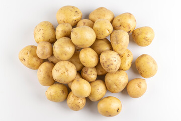 New raw potatoes isolated on white background close up, top view, flat lay