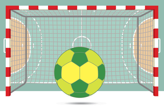 handball ball in front of goal posts with aerial view of court in background