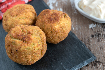 Homemade croquettes stuffed with broccoli and Parmesan cheese