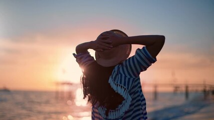 Joyful woman going on sea coast at sunset having fun and positive emotion. 4k Dragon RED camera
