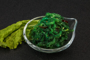 Green Chuka Seaweed Salad Isolated on White Background Top View. Wakame Sea Kelp Salat