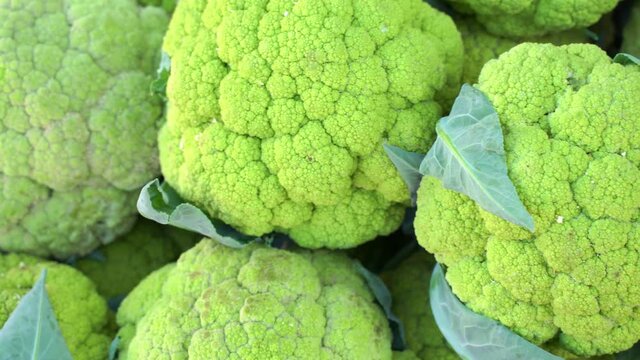 Fresh green cauliflower on a market stall