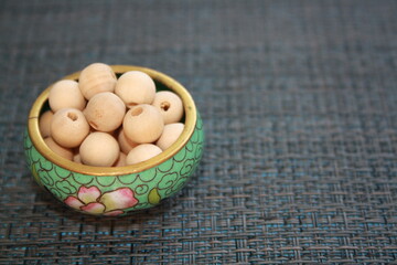 Wooden beads on a gray background.