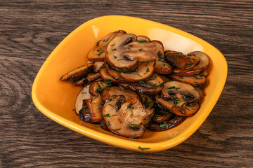 Roasted champignon with herbs and spices