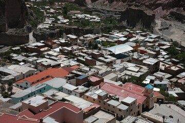 A mountain village in china with different colored roofs