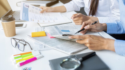 Young unemployed is searching for a job in the newspaper and laptop. Interview the job and hiring...