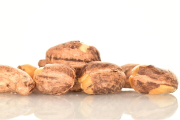 Fragrant fried salted cashews, close-up, isolated on white.