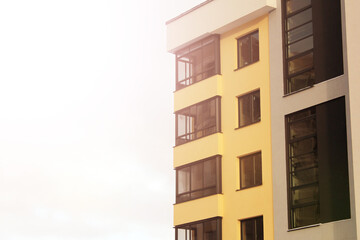 Facade of a new yellow building, modern house