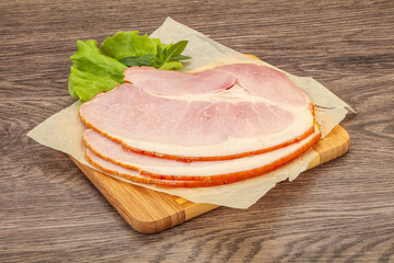 Sliced pork belly over board