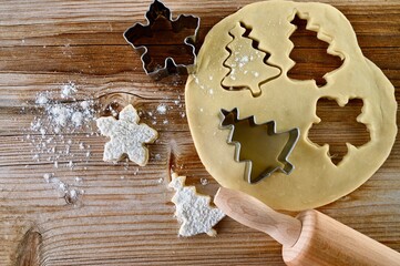 Making cookies for Christmas. Raw dough and Christmas bakeware. 