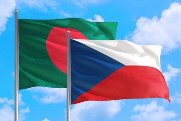 Czech Republic and Bangladesh national flag waving in the windy deep blue sky. Diplomacy and international relations concept.