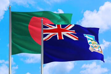 Falkland Islands and Bangladesh national flag waving in the windy deep blue sky. Diplomacy and...
