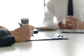 Successful job interview, Recruiter or manager and job candidate with resume in office.