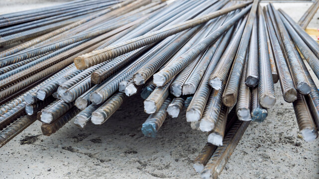End of  steel rods or bars at the construction site. Rustic Metal Armature Rod. Building Construction Background