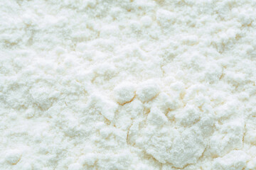 Flour or snow texture. Defocused White textured background. Blurred view, selective focus.