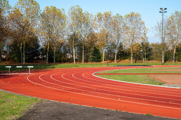 Red running lane on outdoor school stadium