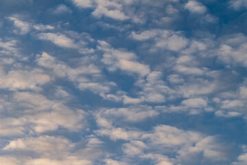 Fluffy clouds in the autumn evening sky
