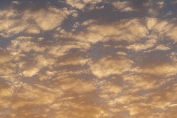 Fototapeta premium Fluffy clouds in the autumn evening sky
