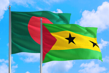 Sao Tome And Principe and Bangladesh national flag waving in the windy deep blue sky. Diplomacy and international relations concept.