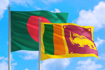 Sri Lanka and Bangladesh national flag waving in the windy deep blue sky. Diplomacy and international relations concept.