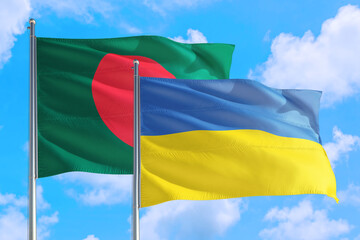 Ukraine and Bangladesh national flag waving in the windy deep blue sky. Diplomacy and international relations concept.