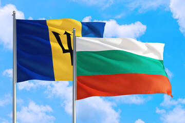 Bulgaria and Barbados national flag waving in the windy deep blue sky. Diplomacy and international relations concept.