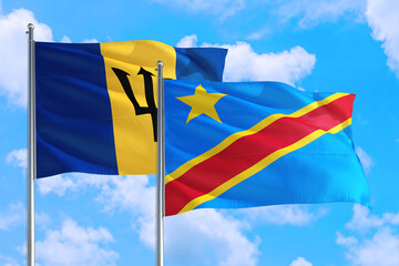 Congo and Barbados national flag waving in the windy deep blue sky. Diplomacy and international relations concept.