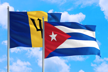 Cuba and Barbados national flag waving in the windy deep blue sky. Diplomacy and international relations concept.