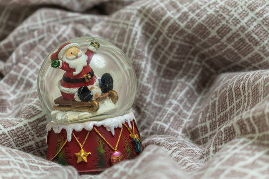 Christmas background. Snowball. Santa claus on a sleigh.