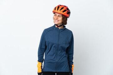 Young English cyclist woman isolated on white background looking to the side and smiling